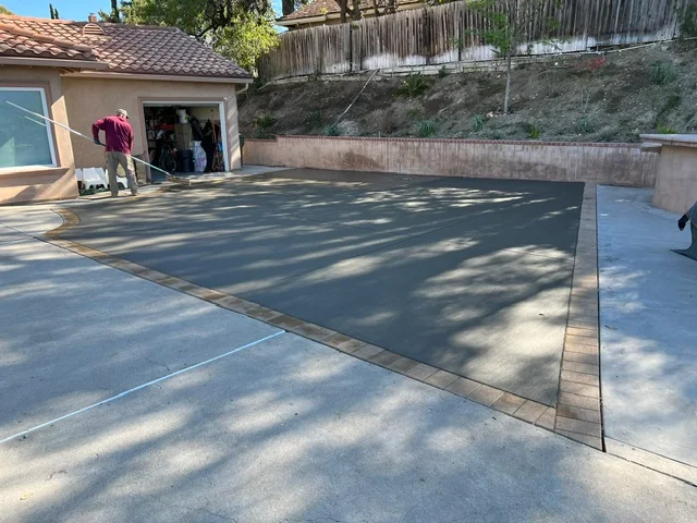 Finished concrete patio with decorative borders and clean edges