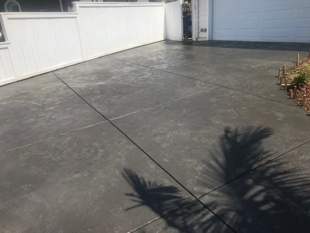 Finished concrete driveway with control joints and proper grading
