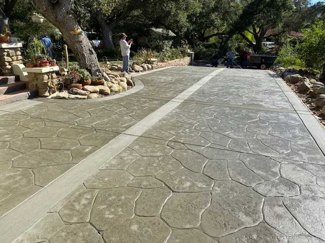 Stamped concrete driveway with stone pattern and border stripe